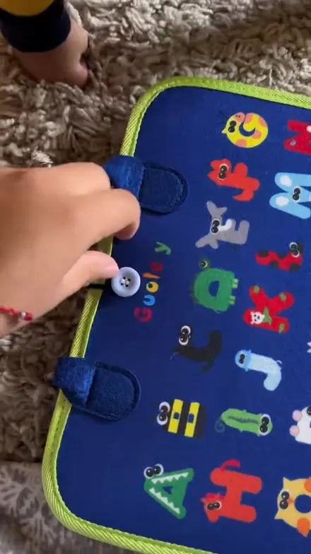 Child playing with the Doolo busy board