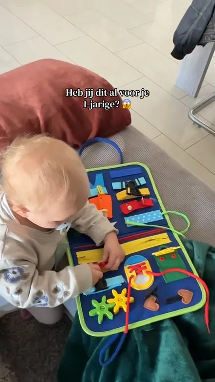 Child playing with the Doolo busy board